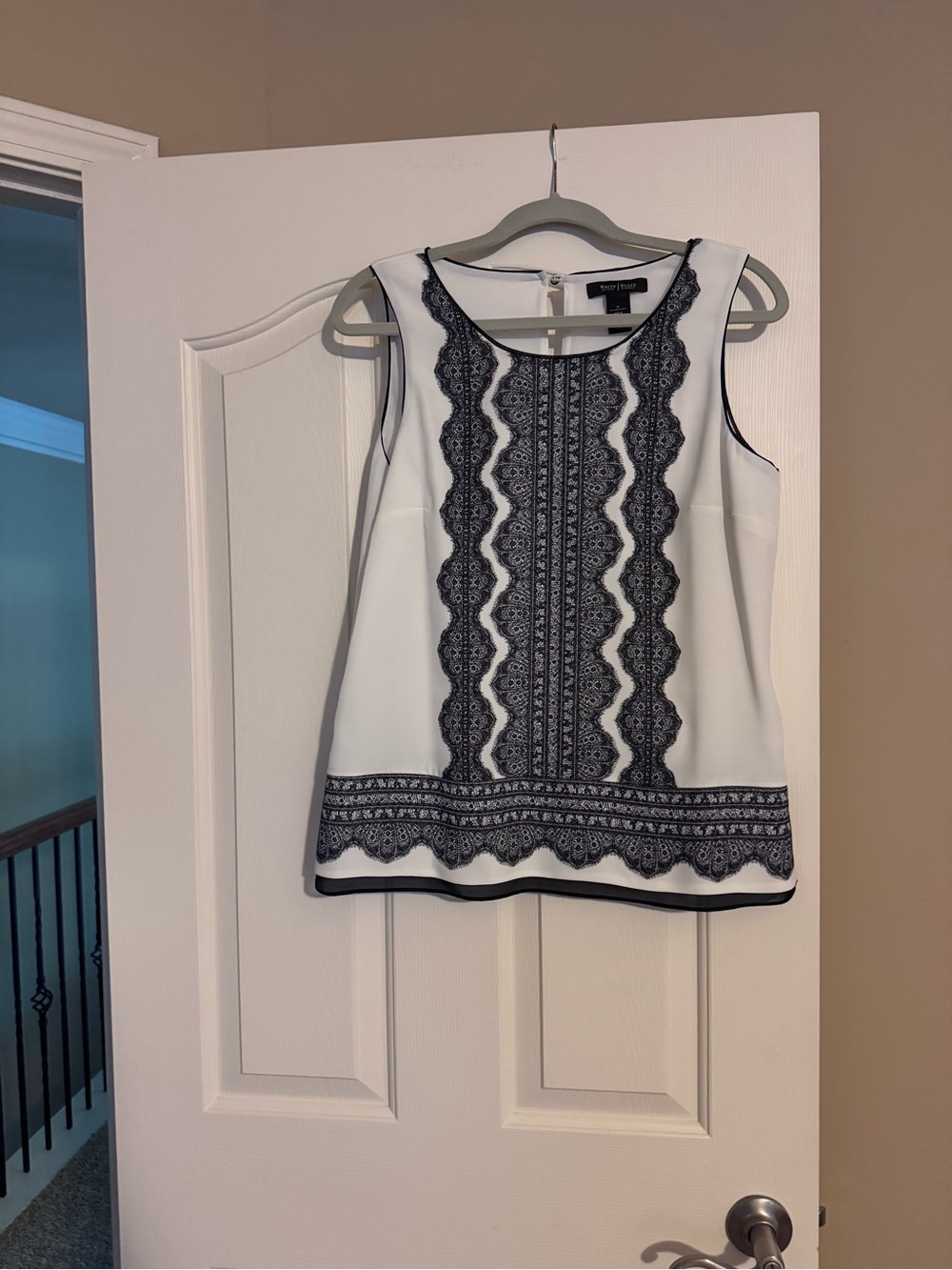 White Sleeveless Top with Black Print Detail